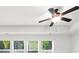Bedroom features a tray ceiling, a ceiling fan, and natural light streaming through windows at 125 Auburn Gate Ln, Auburn, GA 30011