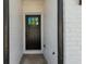 Elegant front door with glass pane and brick surround, showcasing the entrance to this lovely home at 125 Auburn Gate Ln, Auburn, GA 30011