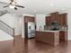 Well-lit kitchen with stainless steel appliances, ample cabinet space, and a functional island at 125 Auburn Gate Ln, Auburn, GA 30011
