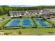 Aerial view of well-maintained community tennis courts, perfect for recreational play and fitness at 125 Auburn Gate Ln, Auburn, GA 30011