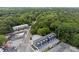 An aerial view showcasing the modern townhome community nestled amongst lush trees at 1570 Flat Shoals Se Rd # 7, Atlanta, GA 30316