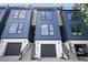 Modern townhouse exterior with garages and landscaped front yards, close up at 1570 Flat Shoals Se Rd # 7, Atlanta, GA 30316