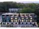 Exterior view of new modern townhouses with garages and well-lit entrances at 1570 Flat Shoals Se Rd # 7, Atlanta, GA 30316