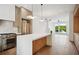 Beautiful open kitchen with stone island and a spacious living area with a fireplace and bright windows at 1570 Flat Shoals Se Rd # 7, Atlanta, GA 30316