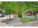 A tree-lined street with sidewalks and restaurants at 1570 Flat Shoals Se Rd # 7, Atlanta, GA 30316