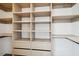 Spacious walk-in closet featuring custom shelving and drawers for ample storage at 1570 Flat Shoals Se Rd # 7, Atlanta, GA 30316