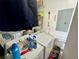 Functional laundry area with washer and dryer, plus storage shelves and necessary cleaning supplies at 177 New Hope Cir, Fayetteville, GA 30214