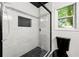 Updated bathroom featuring a glass-enclosed shower with modern tiling and fixtures at 2302 Aurie Dr, Decatur, GA 30034