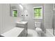 Bathroom featuring gray cabinets, natural light, and modern fixtures at 2302 Aurie Dr, Decatur, GA 30034