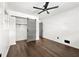 Bedroom with hardwood floors features barn door closet, ceiling fan and closet at 2302 Aurie Dr, Decatur, GA 30034