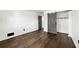 Bedroom features wood floors, white walls, barn door closet, and a gray door at 2302 Aurie Dr, Decatur, GA 30034