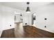 Dining room featuring hardwood floors, white walls, and views into other rooms at 2302 Aurie Dr, Decatur, GA 30034