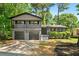 Charming two-story home boasts a painted brick facade, inviting entryway, and a well-manicured front yard at 2302 Aurie Dr, Decatur, GA 30034