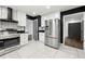 Bright, modern kitchen featuring stainless steel appliances, white cabinetry, and modern accents at 2302 Aurie Dr, Decatur, GA 30034