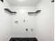Laundry room featuring shelving and black and white tiled floors at 2302 Aurie Dr, Decatur, GA 30034