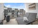 Relaxing balcony with a comfortable daybed and a view of the surrounding neighborhood at 383 Pratt Se Dr # 506, Atlanta, GA 30315