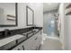 Sleek bathroom showcasing double sinks, a glass-enclosed shower, and modern fixtures at 383 Pratt Se Dr # 506, Atlanta, GA 30315