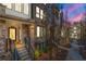 Inviting brick townhome with a well-maintained front yard and a welcoming entrance featuring a metal hand railing at 383 Pratt Se Dr # 506, Atlanta, GA 30315
