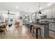 Open-concept kitchen and living area with a large kitchen island and stainless steel appliances at 383 Pratt Se Dr # 506, Atlanta, GA 30315