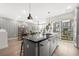 Spacious kitchen featuring a modern island, stainless steel appliances and outdoor balcony at 383 Pratt Se Dr # 506, Atlanta, GA 30315