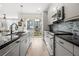 Modern kitchen with stainless steel appliances, granite countertops, and access to the patio at 383 Pratt Se Dr # 506, Atlanta, GA 30315