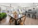 Open-concept living space connecting to a dining area and a modern kitchen with bar stool seating at 383 Pratt Se Dr # 506, Atlanta, GA 30315