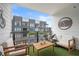 Cozy outdoor patio with furniture, artificial grass, and a view of the surrounding townhomes at 383 Pratt Se Dr # 506, Atlanta, GA 30315