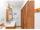 Bathroom showcasing a vanity with wood cabinets and a glass-enclosed shower at 9186 Puckett St, Covington, GA 30014