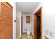Bathroom offering a wood cabinet and doors, plus glass shower and fixtures at 9186 Puckett St, Covington, GA 30014