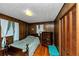 Charming bedroom with wood paneled walls and hardwood floors at 9186 Puckett St, Covington, GA 30014