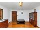Inviting living room with beautiful hardwood floors, elegant light fixture, and dark wood furniture at 9186 Puckett St, Covington, GA 30014