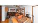 Cozy living room offers natural light and comfortable seating with wooden shelves at 9186 Puckett St, Covington, GA 30014