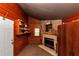 Living Room features a fireplace with a stone surround and built-in shelving at 9186 Puckett St, Covington, GA 30014