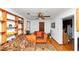Inviting living room featuring a ceiling fan and hardwood floors, creating a warm atmosphere at 9186 Puckett St, Covington, GA 30014