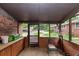 Cozy patio with stone flooring, brick wall, seating, and views of the outdoors at 9186 Puckett St, Covington, GA 30014