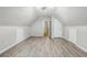Spacious attic features new flooring, storage, updated lighting and a window at 1520 N Milford Creek Sw Ln, Marietta, GA 30008