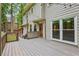 Cozy back deck with string lights, ideal for evening gatherings and enjoying the outdoors at 1520 N Milford Creek Sw Ln, Marietta, GA 30008