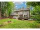 Large backyard with a fire pit, deck, and ample space for outdoor enjoyment at 1520 N Milford Creek Sw Ln, Marietta, GA 30008