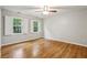 Bedroom with hardwood floors, a ceiling fan, and multiple windows at 1520 N Milford Creek Sw Ln, Marietta, GA 30008