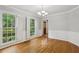 Dining room with hardwood floors, wainscoting, and two large windows with shutters at 1520 N Milford Creek Sw Ln, Marietta, GA 30008