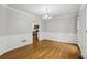 Spacious dining room featuring hardwood floors, wainscoting, and stylish lighting at 1520 N Milford Creek Sw Ln, Marietta, GA 30008