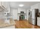 Bright kitchen with stainless steel appliances, granite countertops, and hardwood floors at 1520 N Milford Creek Sw Ln, Marietta, GA 30008
