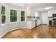 Eat-in kitchen area with stainless steel appliances, wine cooler, and hardwood floors at 1520 N Milford Creek Sw Ln, Marietta, GA 30008