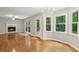 Spacious living room features hardwood floors, a fireplace, and plenty of natural light at 1520 N Milford Creek Sw Ln, Marietta, GA 30008