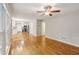 Open living room with hardwood floors, abundant natural light, and access to a modern kitchen at 1520 N Milford Creek Sw Ln, Marietta, GA 30008