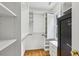 Walk-in closet with custom white shelving and drawers, offering ample storage space at 1520 N Milford Creek Sw Ln, Marietta, GA 30008