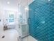 Chic bathroom with a glass-enclosed shower and teal tiled accent wall at 333 Mimosa Dr, Decatur, GA 30030