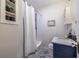Charming bathroom with stylish tile, shower-tub, and a blue vanity with a marble countertop at 333 Mimosa Dr, Decatur, GA 30030