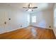 Light bedroom offers hardwood floors, a ceiling fan, and large windows at 333 Mimosa Dr, Decatur, GA 30030