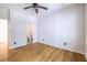 Spacious bedroom with hardwood floors, ceiling fan, and an ensuite bathroom for added convenience at 333 Mimosa Dr, Decatur, GA 30030